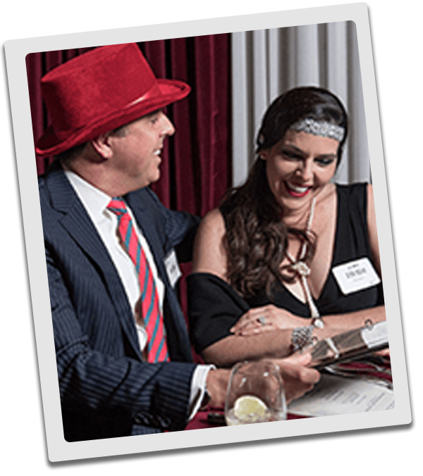 Phoenix Murder Mystery couple checking out the dinner menu